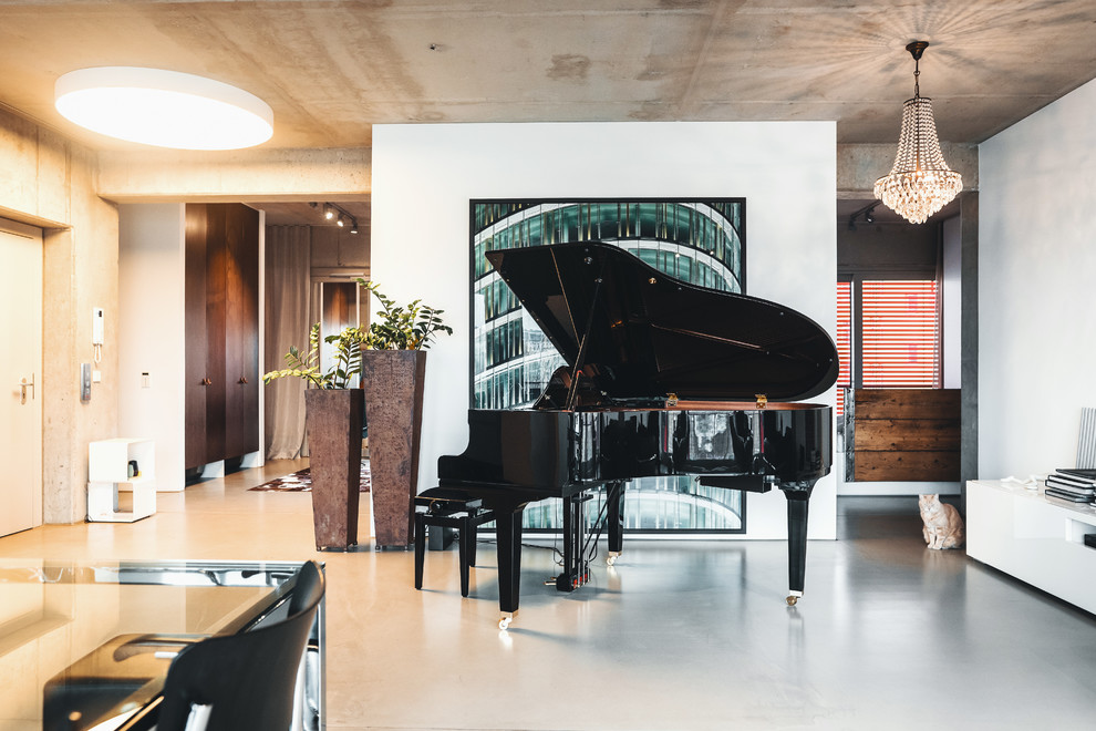 Large contemporary family room in Berlin with white walls, concrete floors and grey floor.