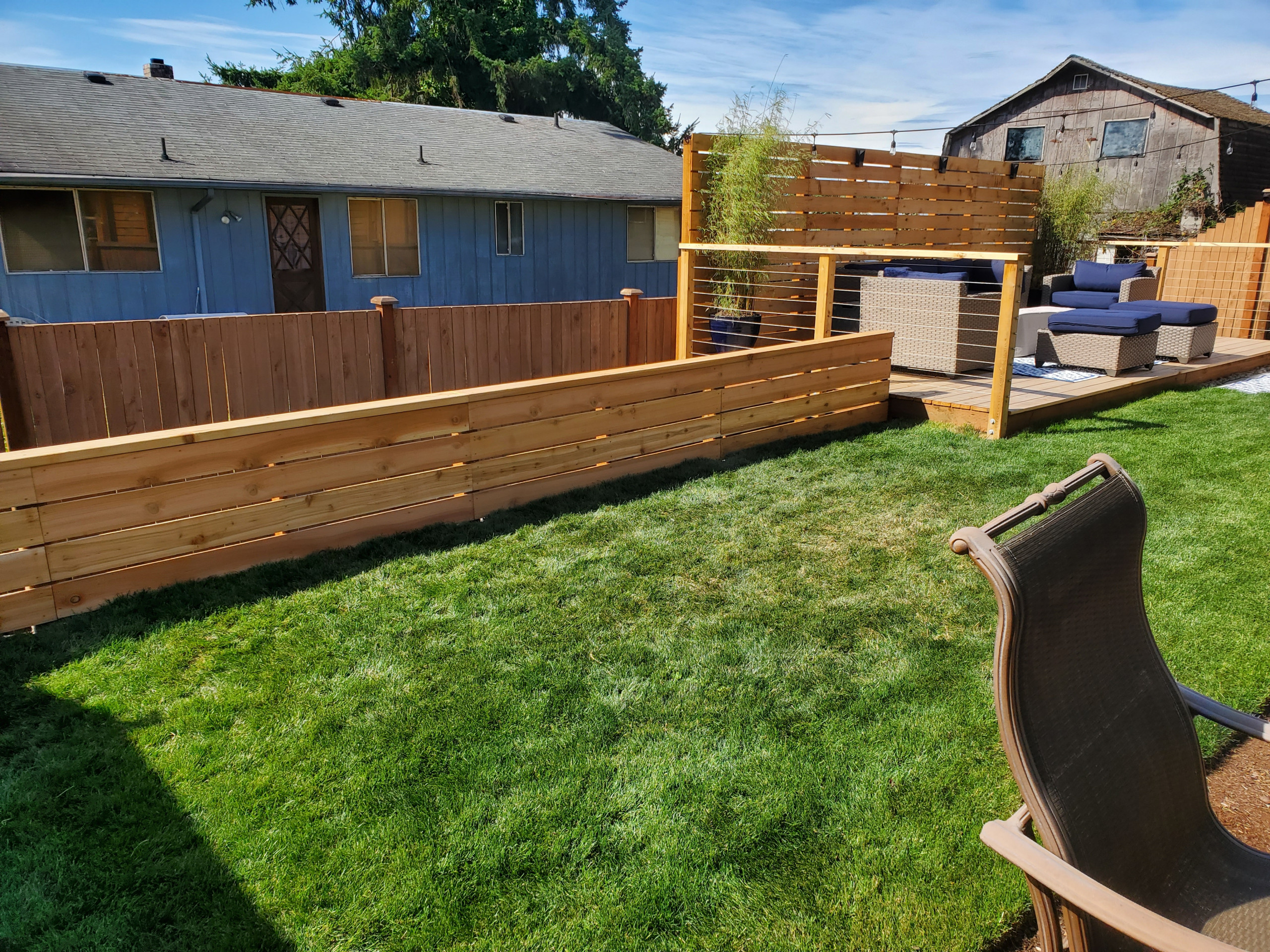 backyard deck with privacy fence/ with a low fence