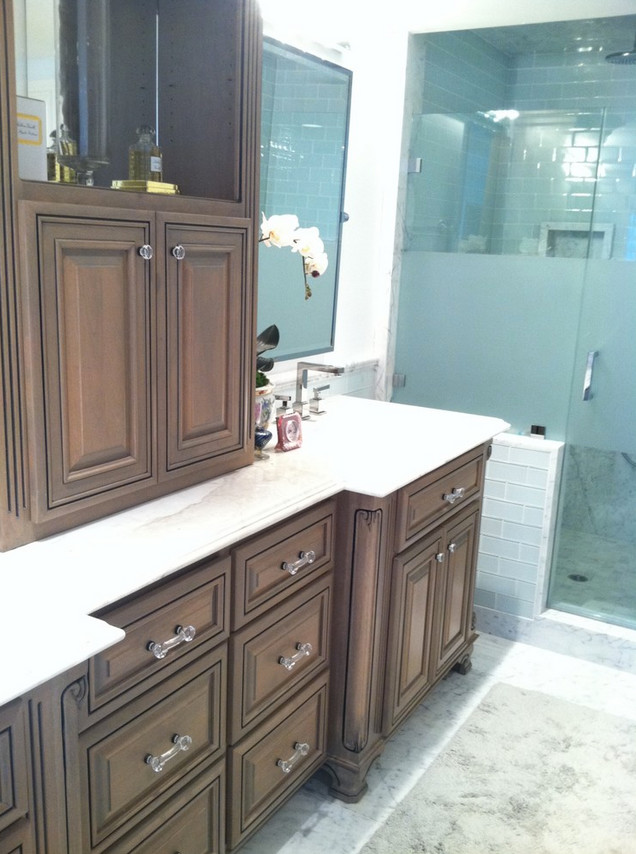 This is an example of a large master bathroom in San Francisco with an undermount sink, raised-panel cabinets, medium wood cabinets, an alcove shower, gray tile, glass tile and white walls.