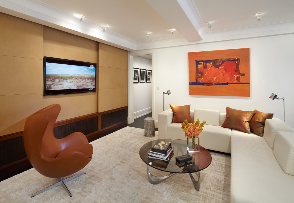 Design ideas for a mid-sized contemporary open concept home theatre in New York with a wall-mounted tv, white walls and carpet.