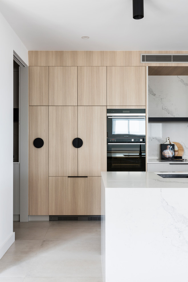 Design ideas for an expansive modern galley kitchen pantry in Sydney with with island.