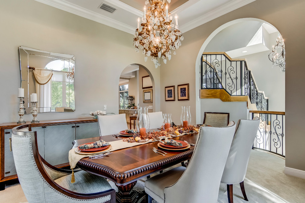 Enclosed dining room - mid-sized transitional carpeted enclosed dining room idea in Miami with blue walls