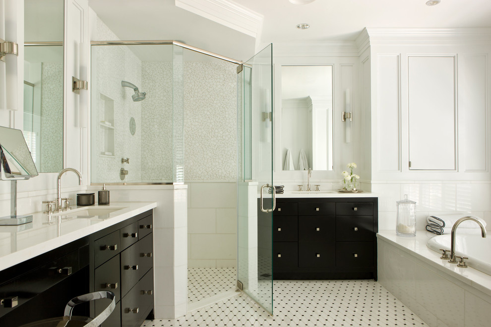 Photo of a transitional bathroom in DC Metro with an undermount sink, flat-panel cabinets, black cabinets, engineered quartz benchtops, a curbless shower, white walls, a drop-in tub, white tile and mosaic tile floors.