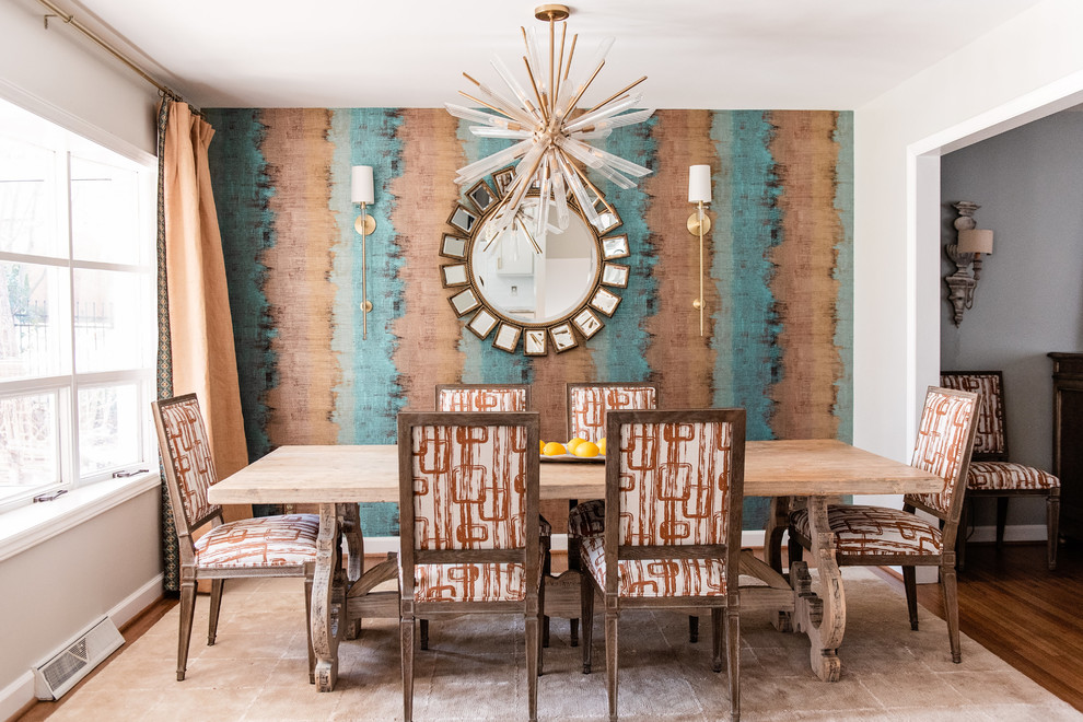 Example of a transitional medium tone wood floor and brown floor kitchen/dining room combo design in Charlotte with beige walls