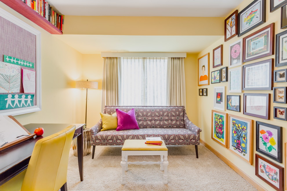 Inspiration for an eclectic study room in Seattle with yellow walls, carpet, no fireplace and a freestanding desk.