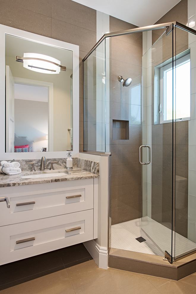 Design ideas for a small contemporary kids bathroom in Miami with beaded inset cabinets, white cabinets, a corner shower, brown tile, porcelain tile, brown walls, porcelain floors, a drop-in sink, granite benchtops, brown floor and a hinged shower door.
