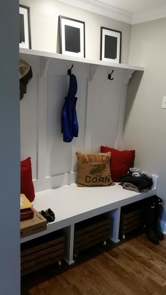 Mudroom - small transitional medium tone wood floor and brown floor mudroom idea in Charlotte with gray walls