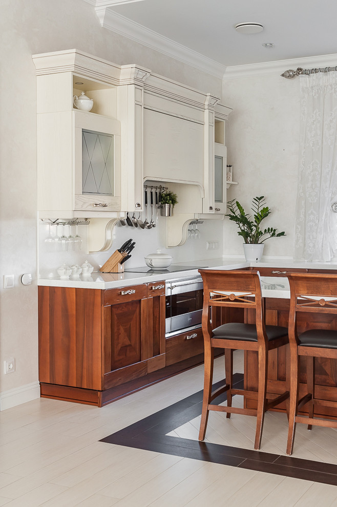 This is an example of a large traditional kitchen in Other with solid surface benchtops, white splashback, white benchtop, an integrated sink, recessed-panel cabinets, dark wood cabinets and stone slab splashback.