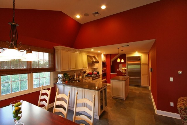Inspiration for a mid-sized transitional u-shaped ceramic tile eat-in kitchen remodel with an undermount sink, stainless steel appliances, an island, raised-panel cabinets, light wood cabinets, granite countertops and beige backsplash