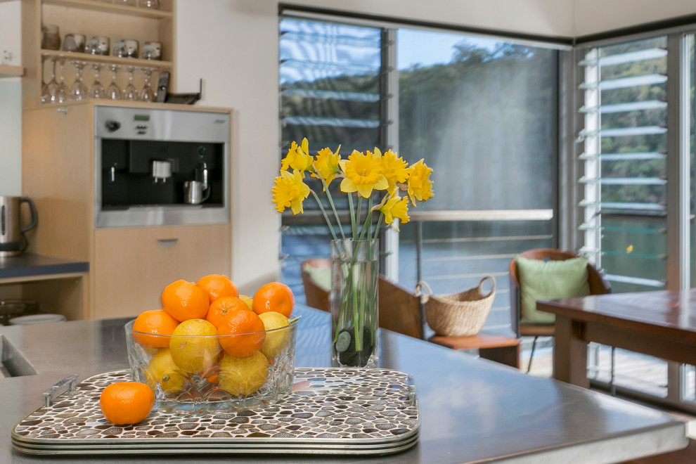 Photo of a large contemporary single-wall open plan kitchen in Sydney with with island.