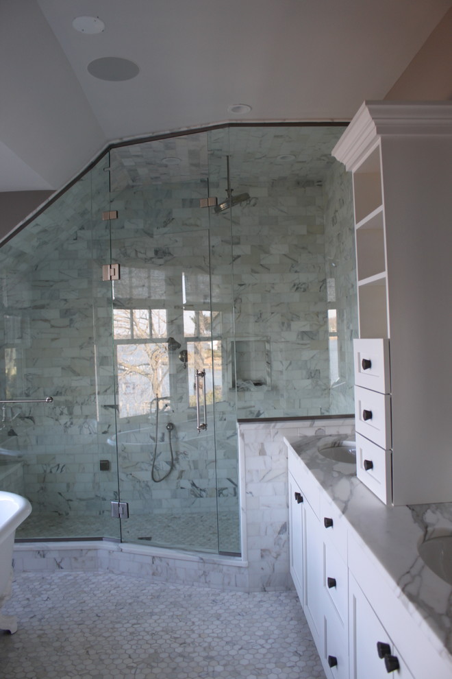 Design ideas for a mid-sized transitional master bathroom in New York with a drop-in sink, flat-panel cabinets, white cabinets, marble benchtops, a claw-foot tub, an alcove shower, a one-piece toilet, yellow tile, white walls and marble floors.