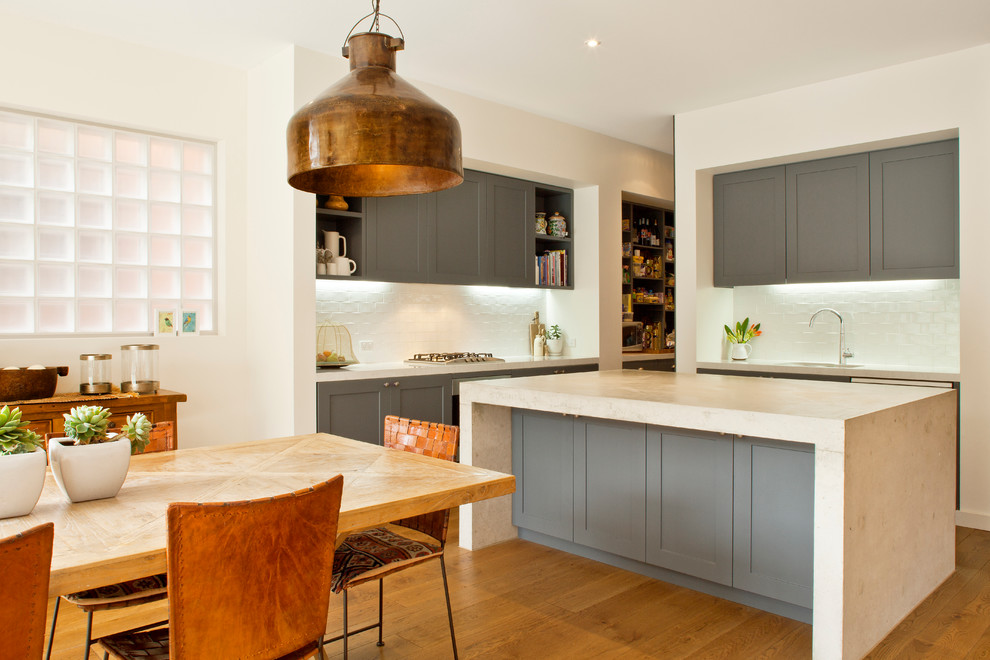 Inspiration for a contemporary eat-in kitchen in Sydney with grey cabinets.
