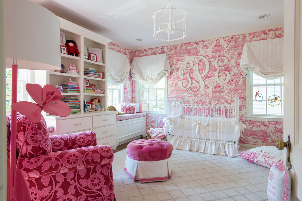 Traditional nursery in Dallas with pink walls for girls.