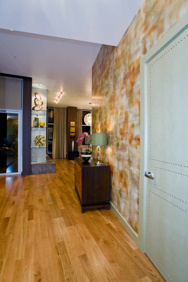 Inspiration for a mid-sized contemporary entry hall in Portland with medium hardwood floors.