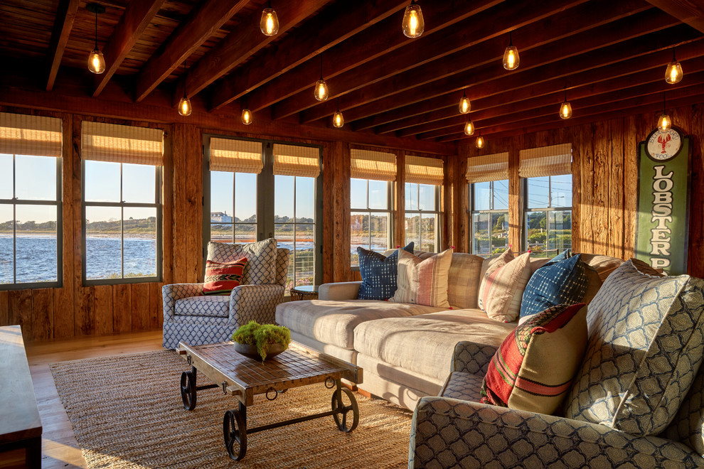Photo of a beach style sunroom in Portland Maine with medium hardwood floors and a standard ceiling.