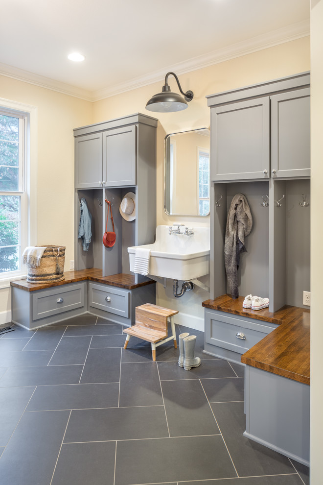 Transitional mudroom in Portland with beige walls.