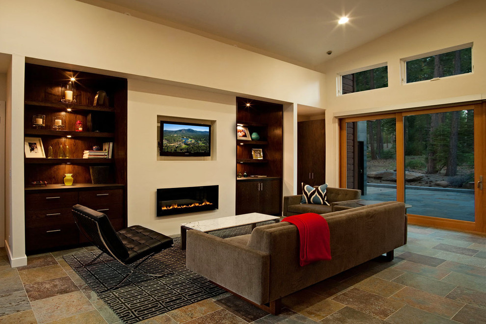 Contemporary family room in Sacramento with beige walls, a ribbon fireplace and a wall-mounted tv.
