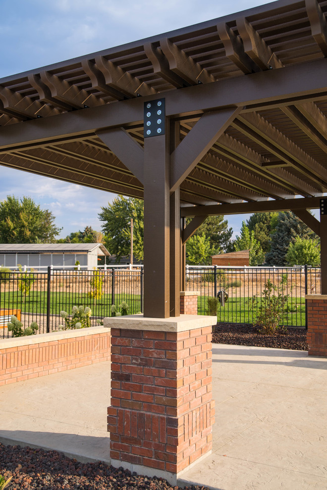 Design ideas for a traditional backyard patio in Boise with a pergola.