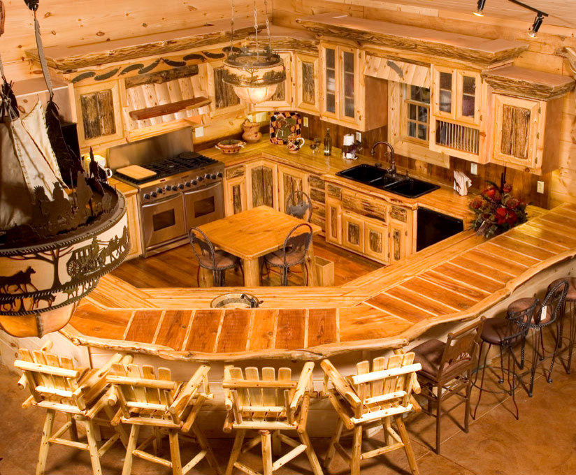 Example of a mountain style medium tone wood floor home design design in Atlanta with a triple-bowl sink, light wood cabinets and an island