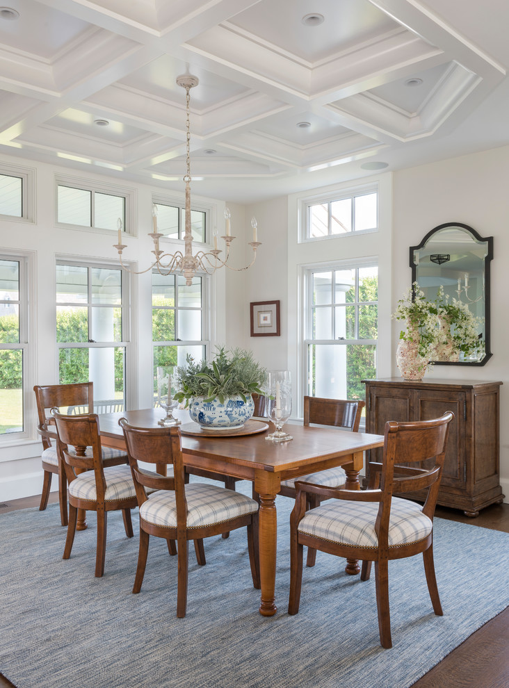 This is an example of a beach style dining room in Boston with beige walls, dark hardwood floors and no fireplace.