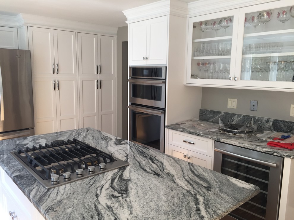 Example of a large transitional u-shaped eat-in kitchen design in Boston with recessed-panel cabinets, white cabinets, granite countertops and stainless steel appliances