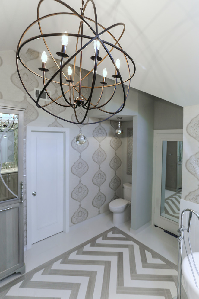 Freestanding bathtub - mid-sized transitional master gray tile and porcelain tile porcelain floor freestanding bathtub idea in Houston with an undermount sink, furniture-like cabinets, gray cabinets, quartzite countertops, a two-piece toilet and gray walls