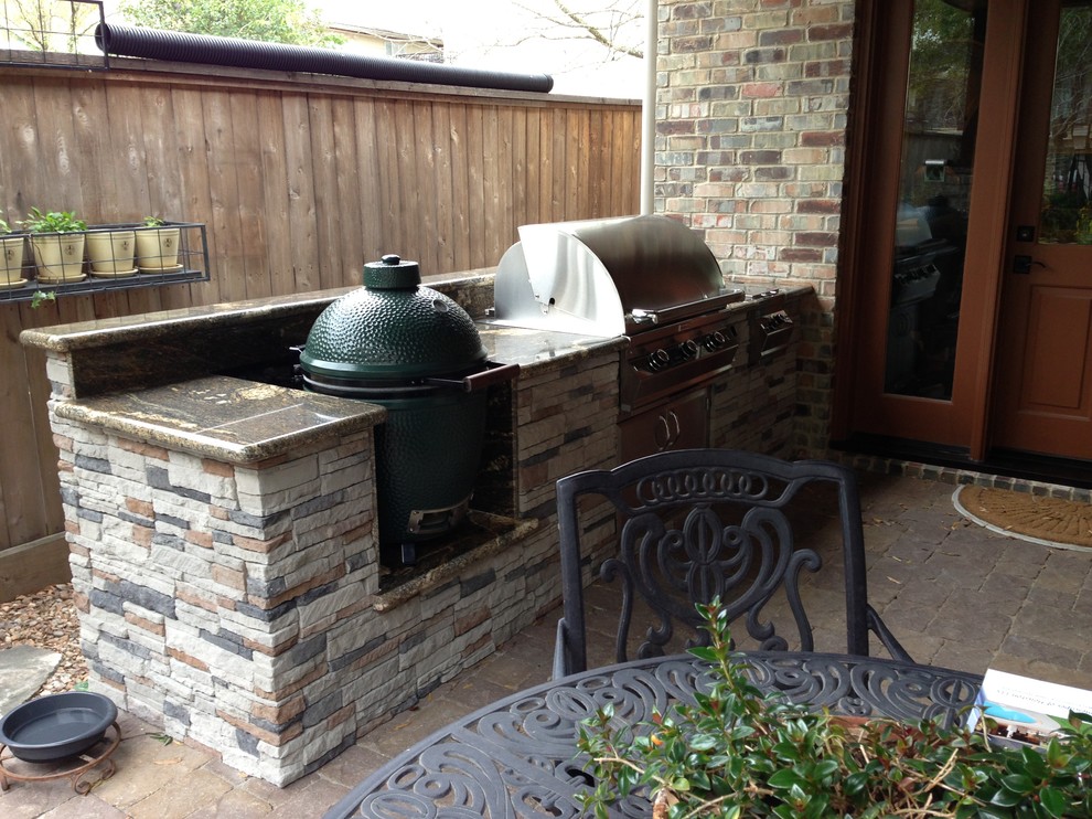 This is an example of a contemporary backyard concrete paver landscaping in Houston.