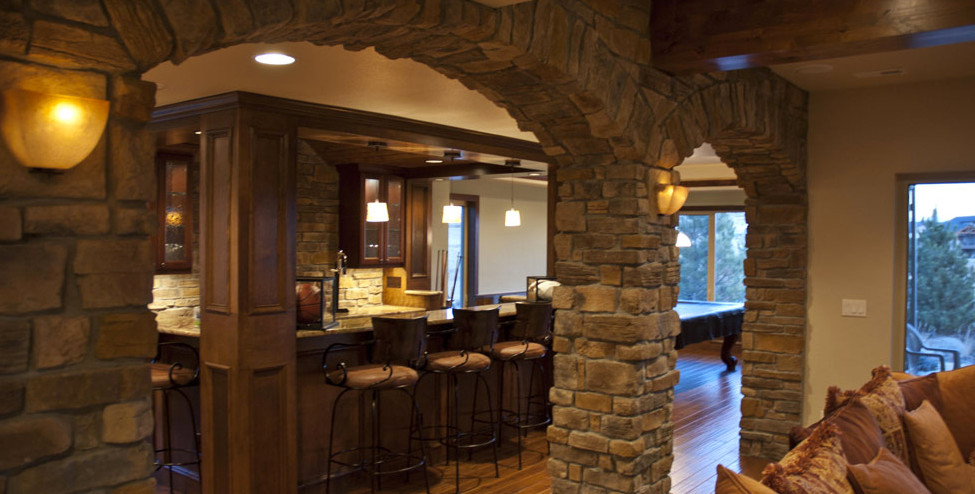 Mountain style basement photo in Denver