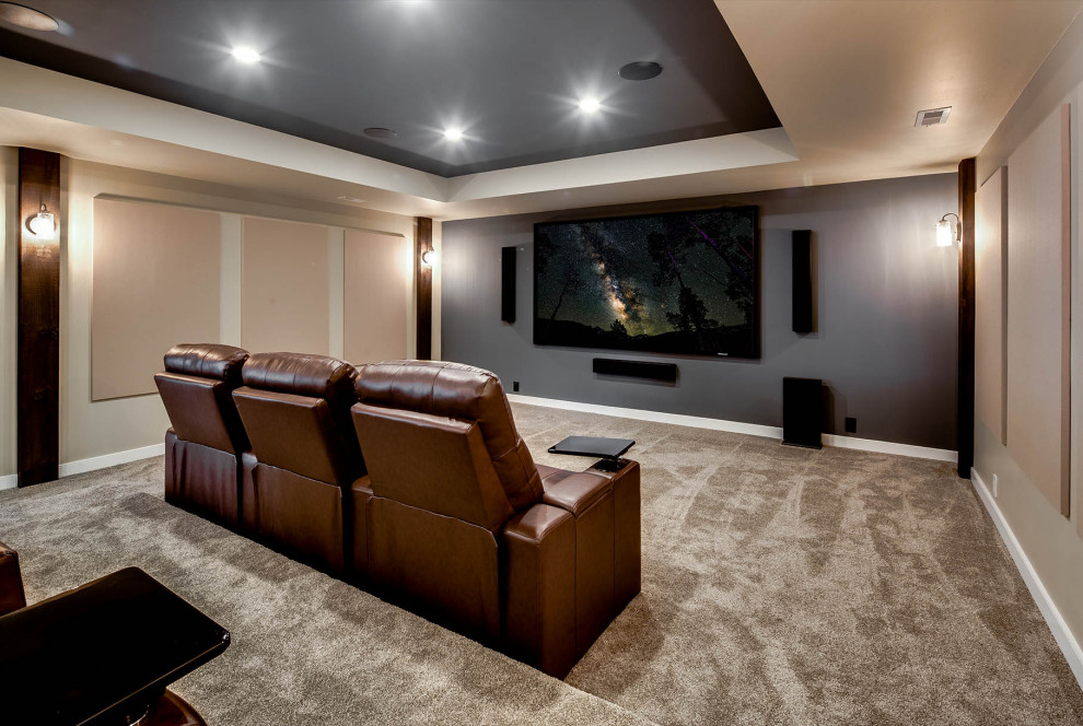 Large transitional enclosed carpeted home theater photo in Birmingham with a projector screen