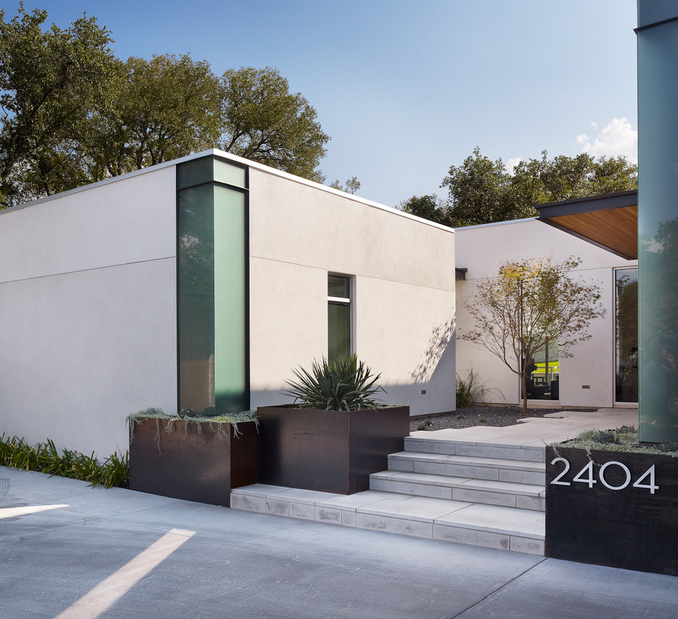 Inspiration for a contemporary one-storey white exterior in Austin.