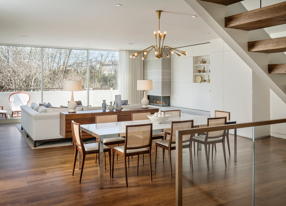 Photo of a contemporary open plan dining in San Francisco with white walls and dark hardwood floors.