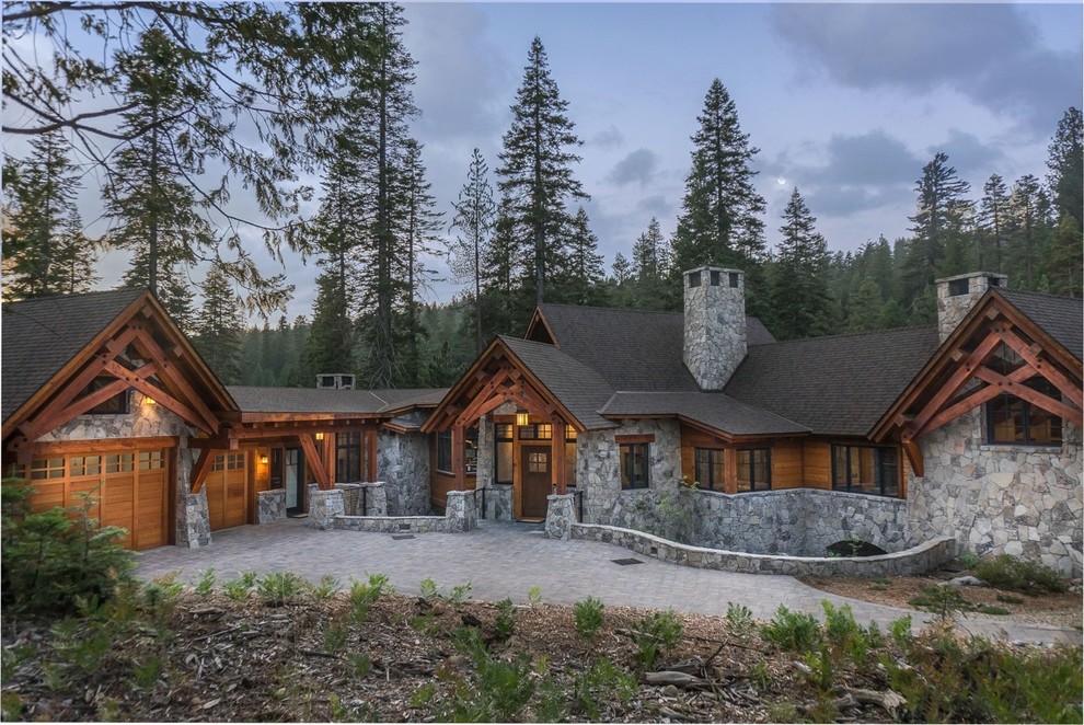 Country one-storey grey house exterior in Sacramento with stone veneer, a gable roof and a shingle roof.