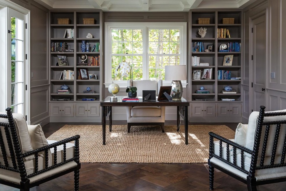 Inspiration for a traditional home office in Los Angeles with grey walls, dark hardwood floors, a freestanding desk and brown floor.