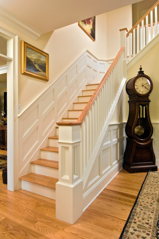 Photo of a traditional wood l-shaped staircase in Boston.