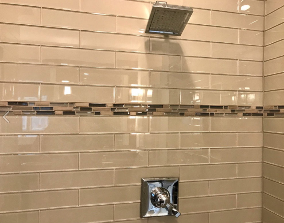 Large transitional master gray tile and glass tile mosaic tile floor and multicolored floor alcove shower photo with gray walls and a hinged shower door