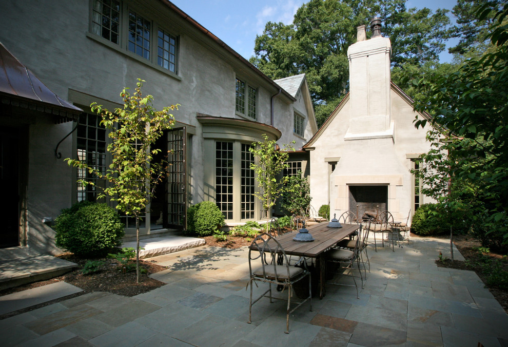 Photo of a traditional patio in Charlotte with a fire feature.