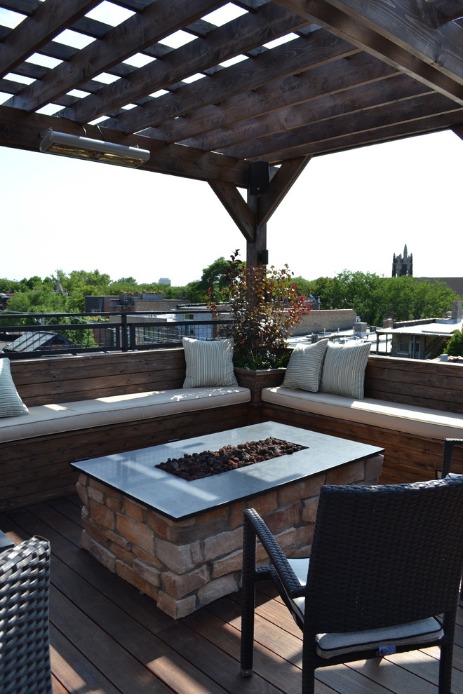 Design ideas for an expansive transitional rooftop deck in Chicago with a fire feature and a pergola.