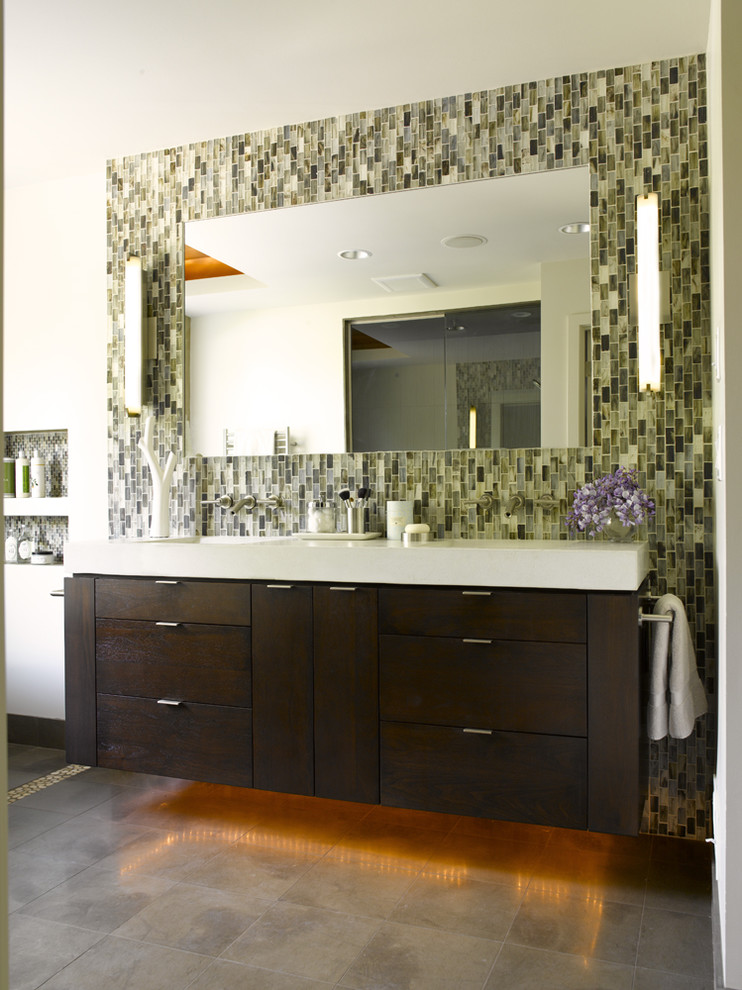 This is an example of a contemporary bathroom in Seattle with flat-panel cabinets, dark wood cabinets, a freestanding tub, green walls and brown floor.