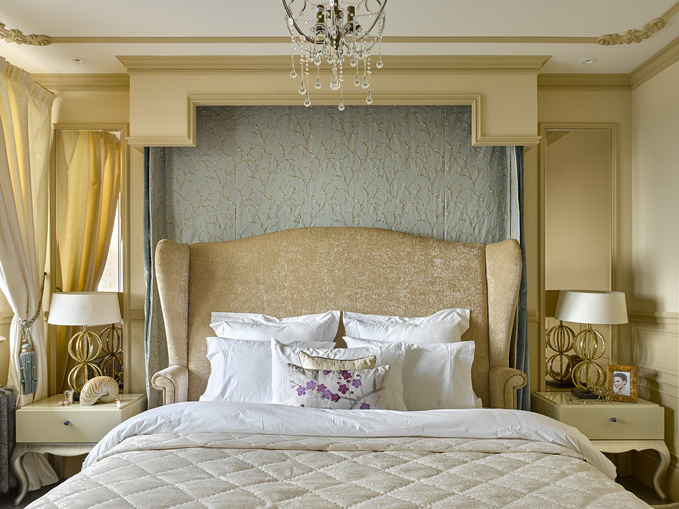 Traditional master bedroom in London with beige walls.