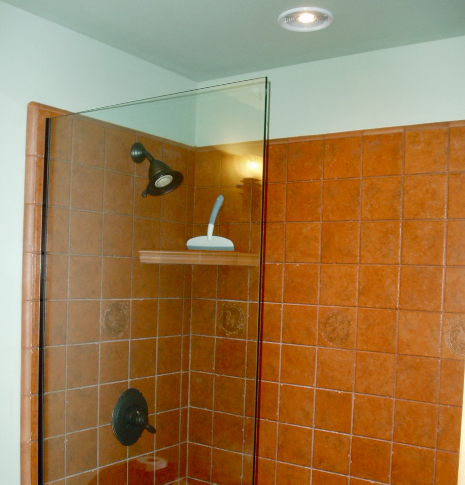 This is an example of an arts and crafts bathroom in Seattle with an open shower and ceramic floors.