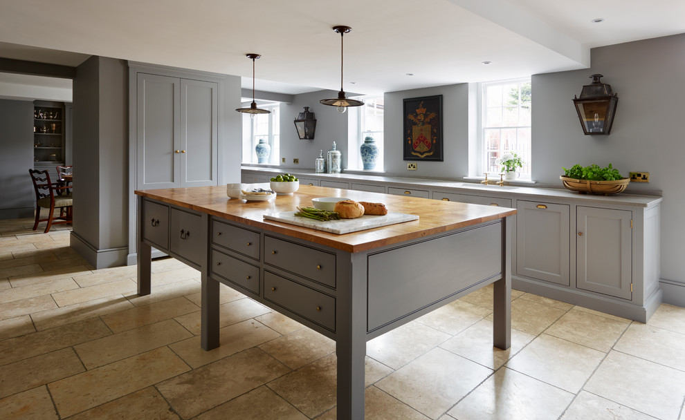 Large transitional open plan kitchen in Essex with recessed-panel cabinets, grey cabinets, panelled appliances and with island.
