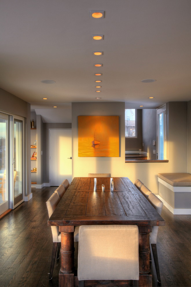 Dining room - large transitional dark wood floor and brown floor dining room idea in Boston with gray walls and no fireplace