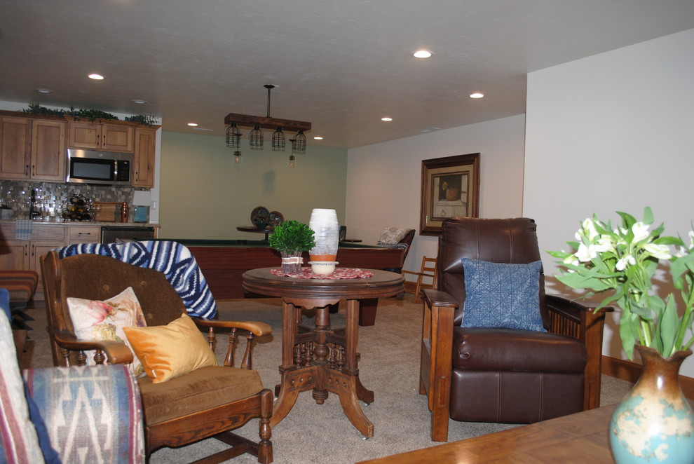 Example of a small mountain style enclosed carpeted and brown floor family room design with white walls, no fireplace and no tv
