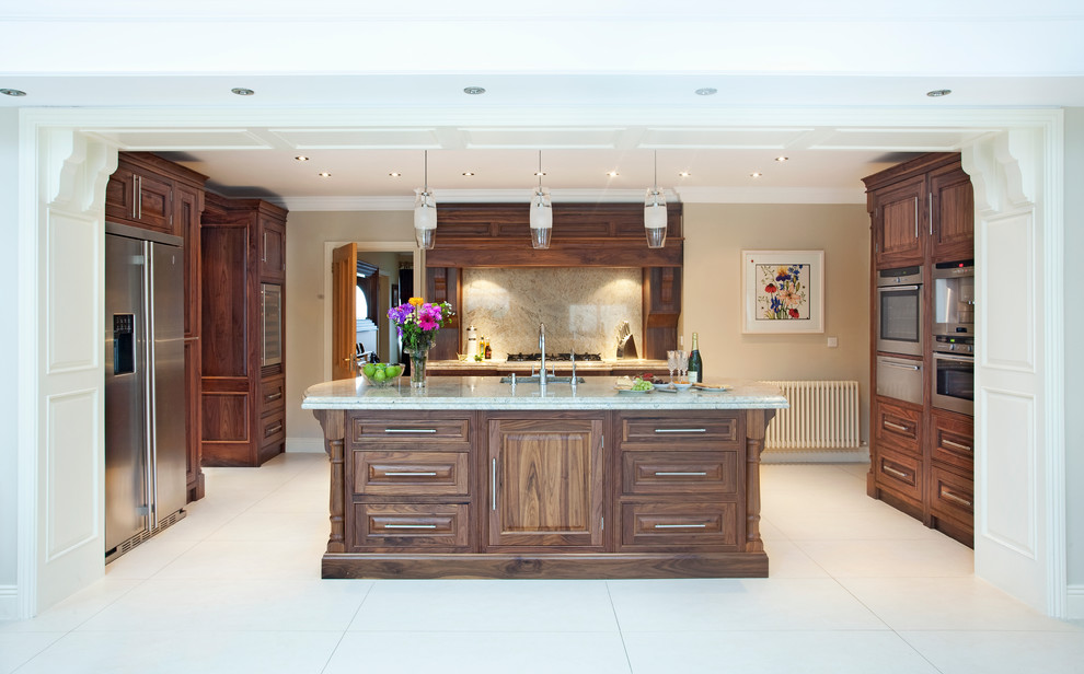 Inspiration for a mid-sized traditional u-shaped eat-in kitchen in Other with an undermount sink, raised-panel cabinets, dark wood cabinets, granite benchtops, stone slab splashback, stainless steel appliances, porcelain floors and with island.