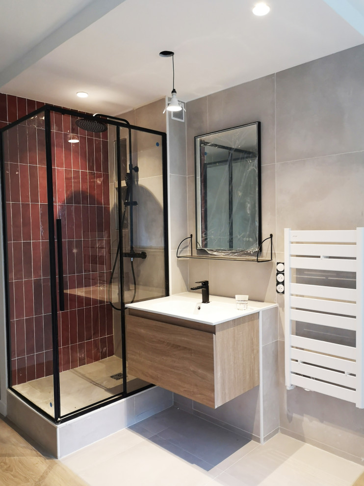 This is an example of a small contemporary shower room bathroom in Paris with flat-panel cabinets, beige cabinets, a corner shower, red tiles, ceramic tiles, beige walls, ceramic flooring, a console sink, solid surface worktops, beige floors, a sliding door, white worktops, a single sink and a floating vanity unit.