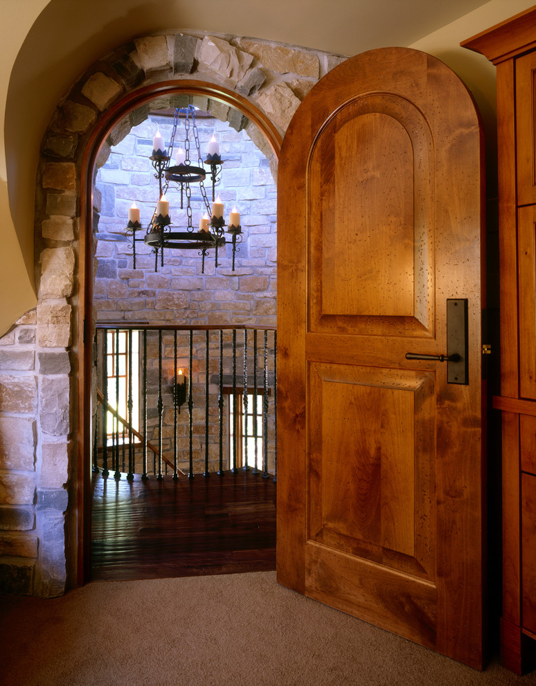This is an example of a traditional entryway in Minneapolis with yellow walls and carpet.