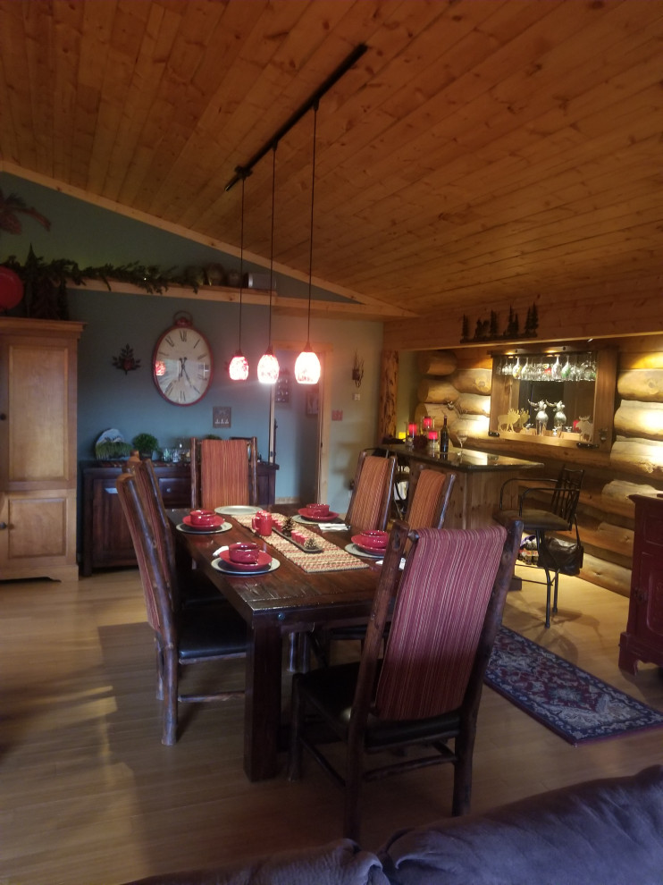 Dining room - rustic dining room idea in Denver