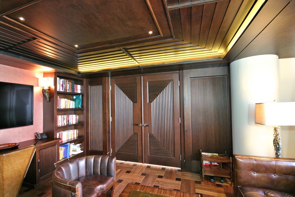 Photo of a mid-sized transitional study room in Chicago with medium hardwood floors and brown walls.