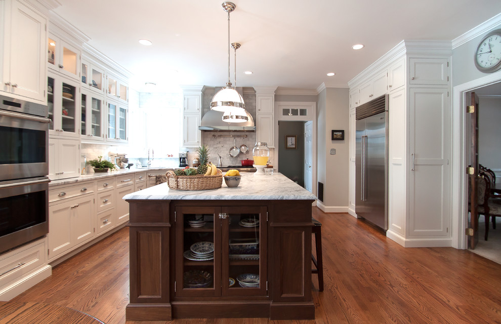 Large transitional kitchen photo in DC Metro with beaded inset cabinets, white cabinets, marble countertops, white backsplash, subway tile backsplash, stainless steel appliances and an island