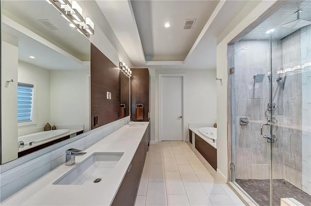 Large contemporary master bathroom in Dallas with flat-panel cabinets, medium wood cabinets, a drop-in tub, an alcove shower, white walls, porcelain floors, an undermount sink, quartzite benchtops, white floor, a hinged shower door and white benchtops.